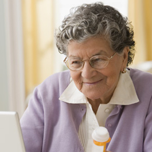 Senior Hispanic woman looking up medication online