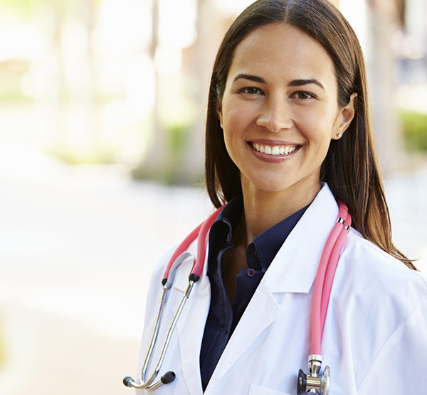 Female doctor standing outside