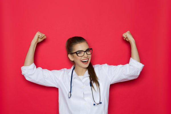 avoiding physician burnout - image of happy and relaxed female doctor