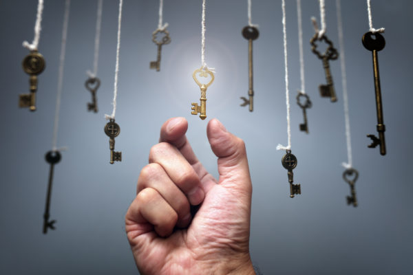 Weatherby Healthcare - top locum tenens agencies - image of hand reaching for golden key among other hanging keys