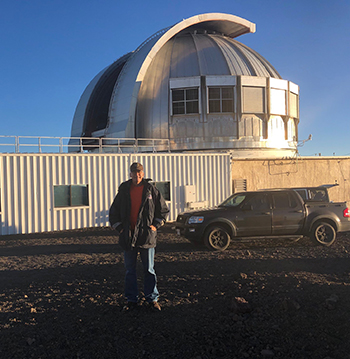 Locum Tenens Dr. Jeffrey Frye at telescope on the Island of Hawaii
