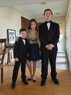 Three children posing for photo