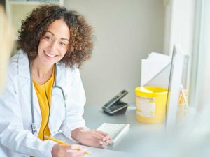 Friendly physician working to patient adherence to instructions