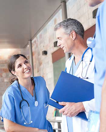 physician and nurse discussing the job fit