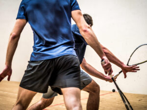Physicians playing racketball and balancing personal life and their medical practice