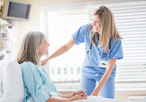 Female locum tenens physician with patient in hospital