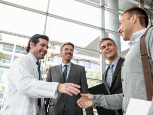 Locum physician and consultants shaking hands