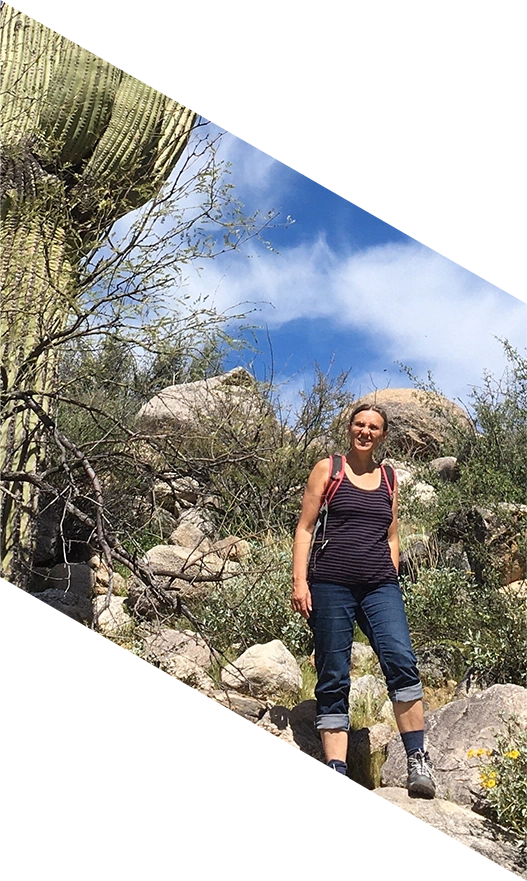Woman enjoys challenging hike in an arid climate.